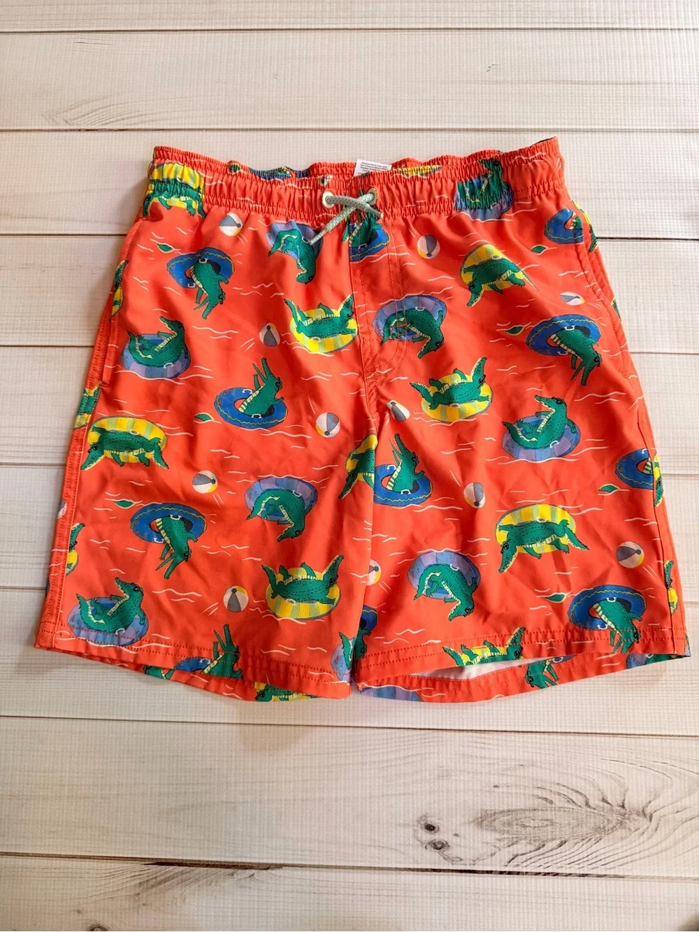 Lot of kids swim trunks and tops